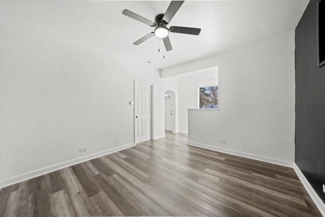 unfurnished room featuring ceiling fan and dark hardwood / wood-style floors