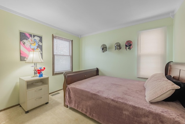 bedroom featuring light carpet, baseboards, visible vents, and crown molding