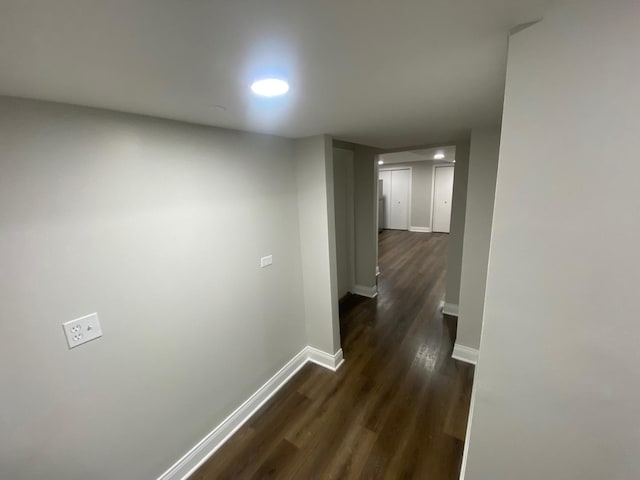 hallway featuring dark hardwood / wood-style flooring