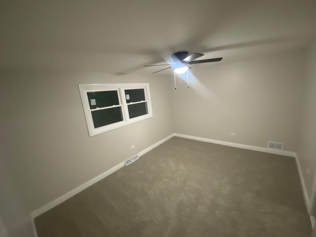 unfurnished room featuring carpet and ceiling fan