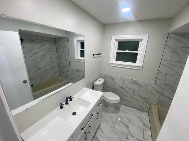 bathroom with toilet, tile walls, and vanity