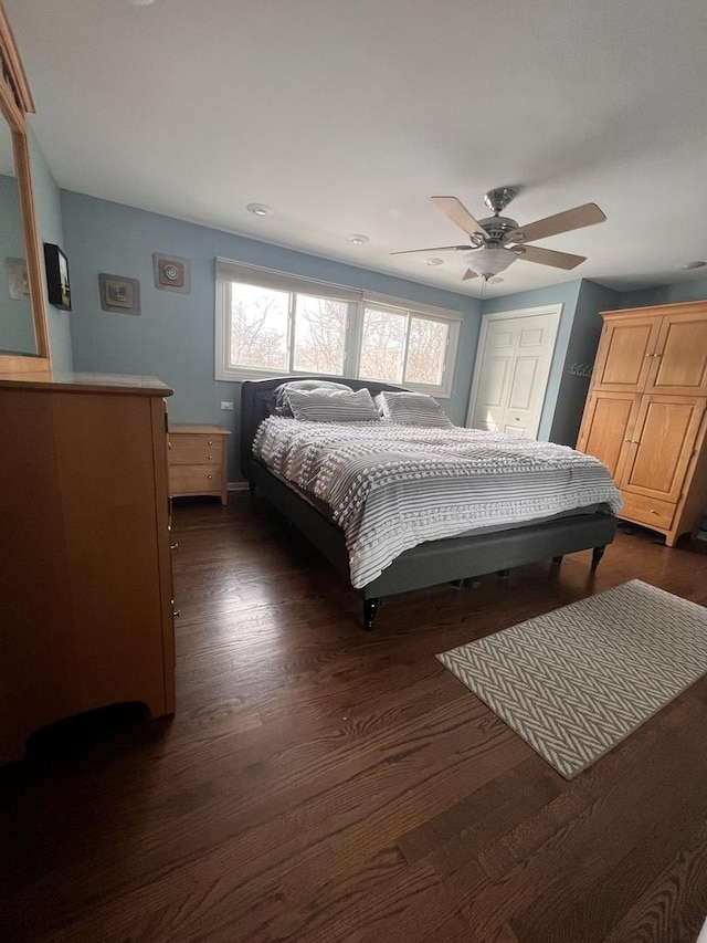 bedroom featuring dark wood-style flooring and ceiling fan