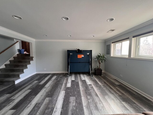 unfurnished living room with a large fireplace, ornamental molding, wood finished floors, and recessed lighting