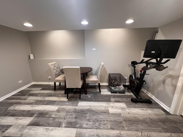 unfurnished living room featuring ornamental molding, dark wood-type flooring, electric panel, and baseboards