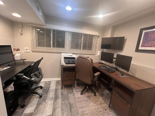 bathroom with toilet, baseboards, visible vents, and a sink