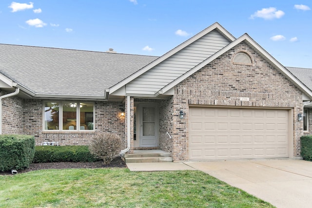 single story home featuring a garage and a front lawn