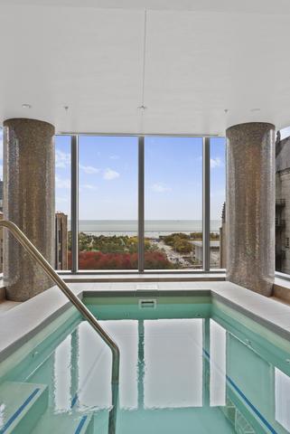 view of swimming pool with an indoor in ground hot tub