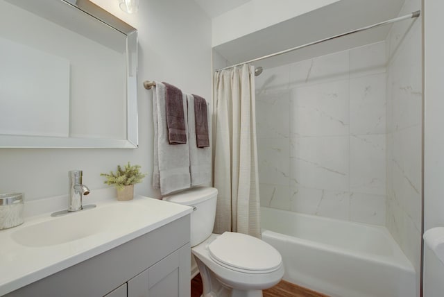 bathroom featuring shower / bath combination with curtain, vanity, and toilet