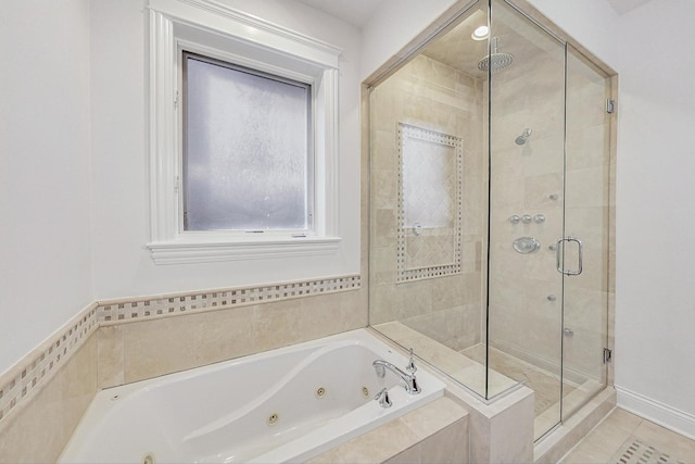 full bathroom featuring a stall shower, tile patterned flooring, and a tub with jets