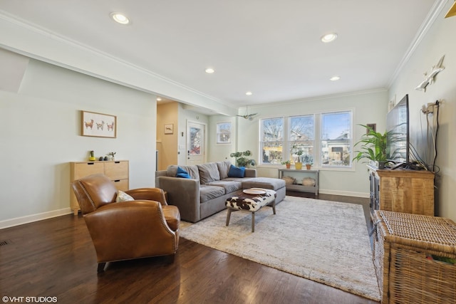 living area featuring baseboards, dark wood finished floors, crown molding, and recessed lighting