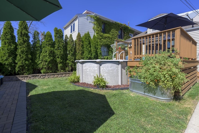 view of yard featuring an outdoor pool