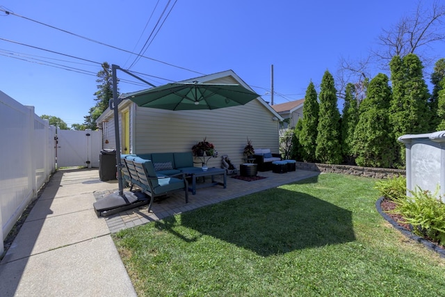 view of yard featuring a gate, fence, and a patio