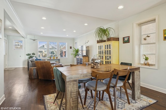 dining space with crown molding, dark wood-style flooring, recessed lighting, and baseboards