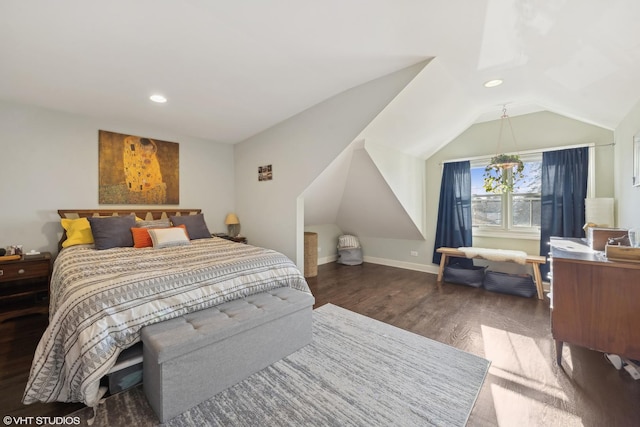 bedroom with lofted ceiling, recessed lighting, dark wood finished floors, and baseboards