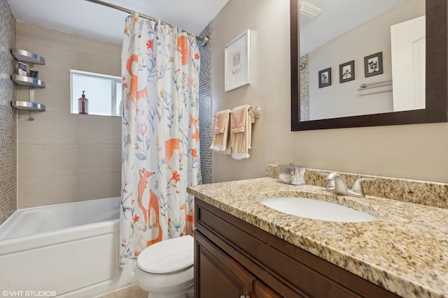 bathroom with toilet, shower / tub combo, visible vents, and vanity