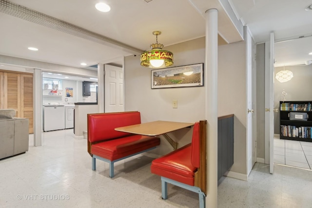 dining area featuring baseboards, washer and clothes dryer, and recessed lighting