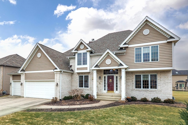 view of front of property with a garage and a front lawn