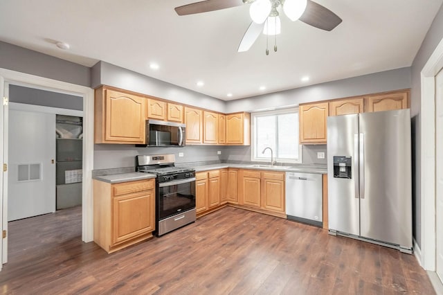 kitchen featuring stainless steel appliances, light countertops, visible vents, and light brown cabinets