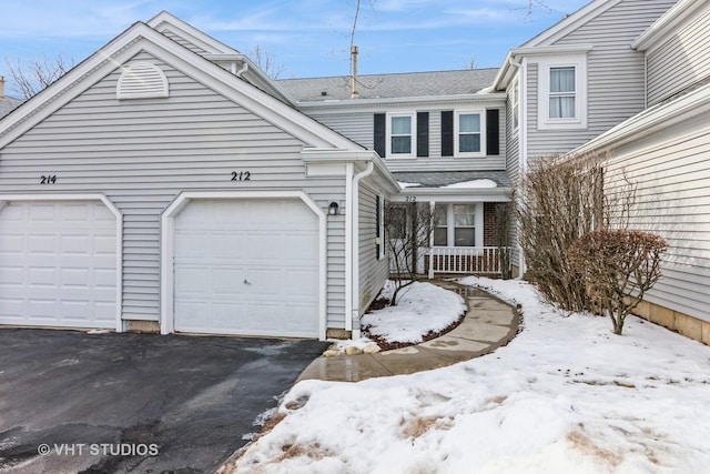 view of front of property with driveway and an attached garage