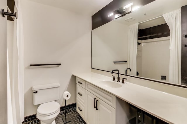 full bath with baseboards, toilet, curtained shower, tile patterned flooring, and vanity