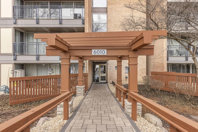 entrance to property featuring brick siding