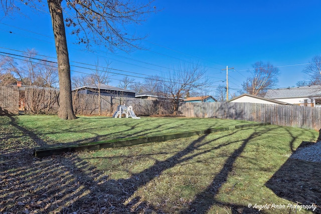 view of yard featuring a fenced backyard