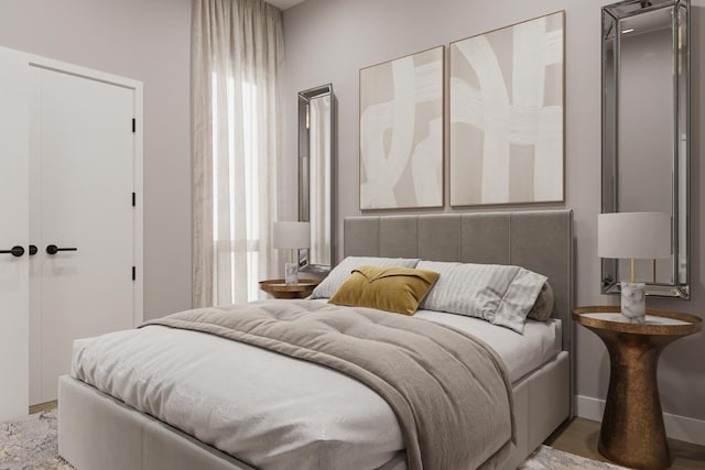 bedroom featuring multiple windows and wood-type flooring