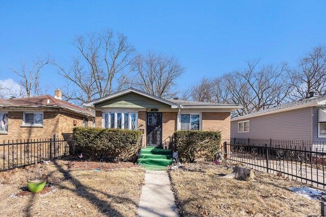 14817 Lexington Ave, Harvey, IL 60426 - bungalow-style home featuring fence and brick siding