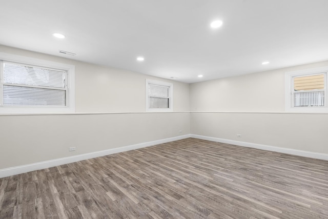 basement with hardwood / wood-style flooring