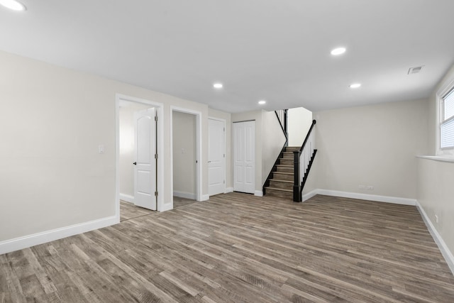 basement with light hardwood / wood-style floors