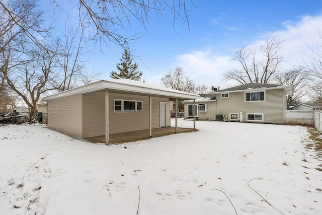 view of snow covered house