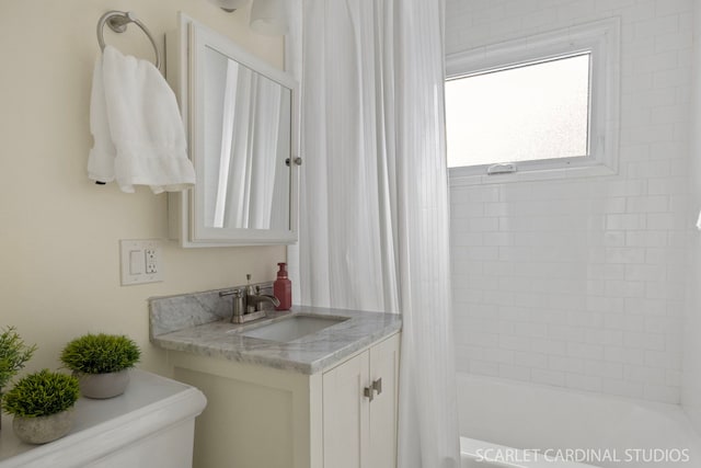 bathroom with shower / tub combo with curtain and vanity