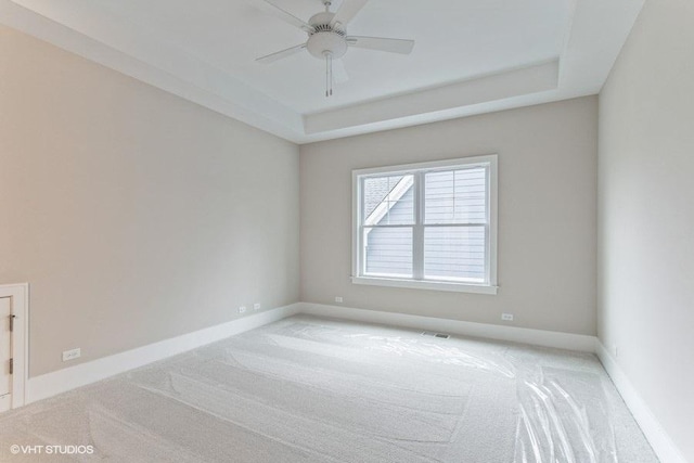 5903 Timber Trails Blvd, Western Springs, IL 60558 - empty room featuring a tray ceiling, light colored carpet, and ceiling fan