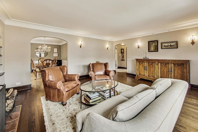 living area featuring arched walkways, dark wood finished floors, and baseboards