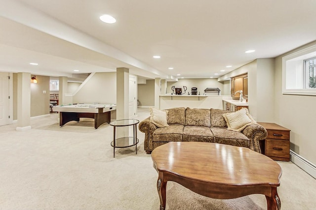 living area featuring baseboards, recessed lighting, a baseboard radiator, and light colored carpet