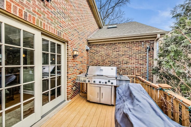 wooden deck with area for grilling