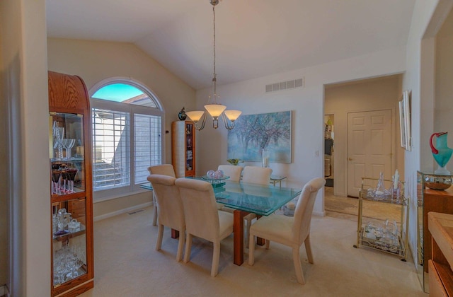 dining space with lofted ceiling, baseboards, visible vents, and light colored carpet