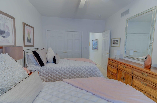 bedroom with a closet, visible vents, ceiling fan, and baseboards