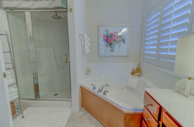 full bathroom featuring a stall shower, a garden tub, and tile patterned floors