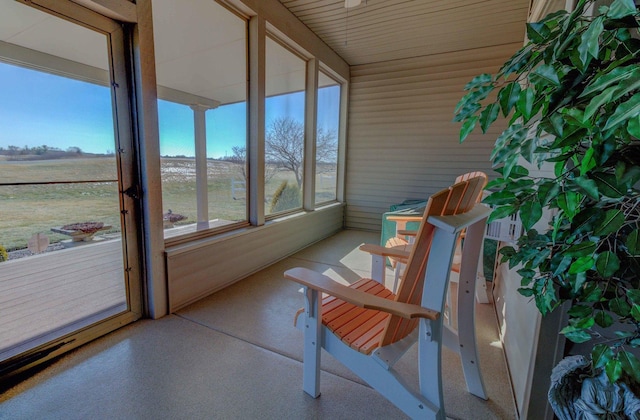 sunroom featuring a rural view