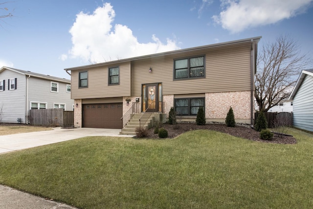 bi-level home featuring a front yard and a garage