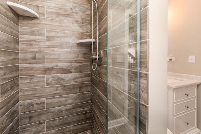 bathroom with tiled shower