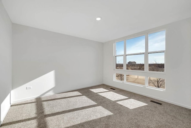 unfurnished room featuring carpet floors