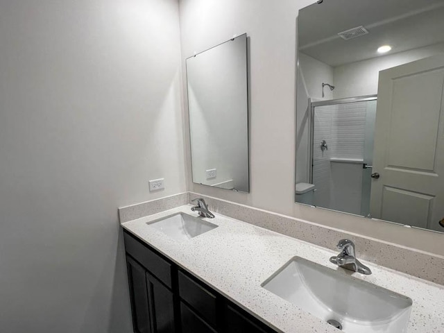 bathroom featuring vanity and walk in shower