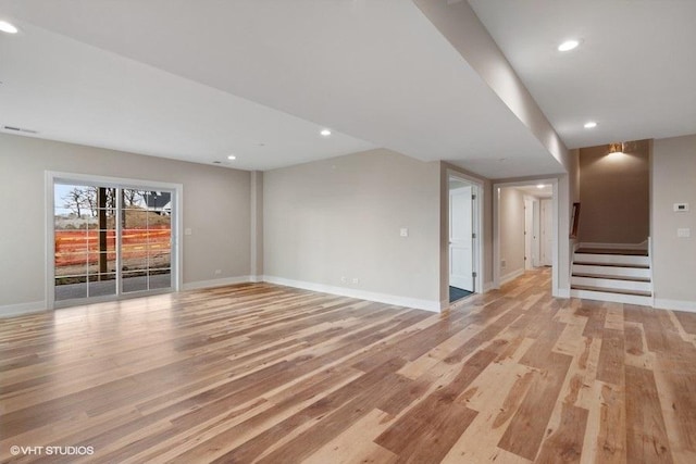 unfurnished living room with light wood-type flooring