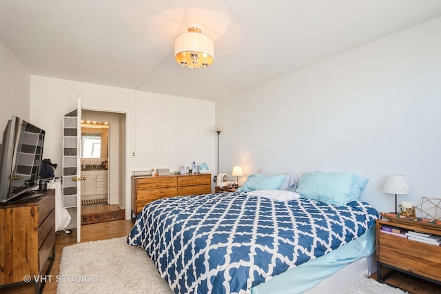 bedroom featuring wood finished floors