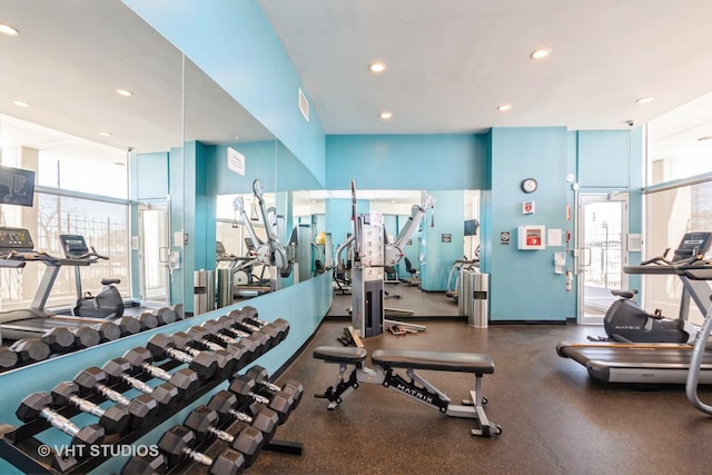 gym featuring baseboards, visible vents, and recessed lighting