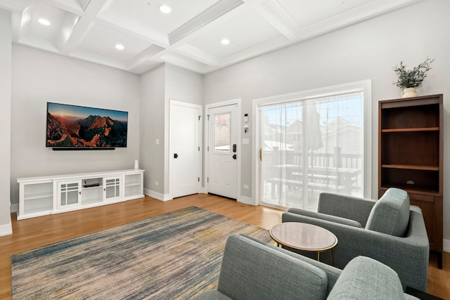 living area with recessed lighting, wood finished floors, coffered ceiling, beamed ceiling, and baseboards