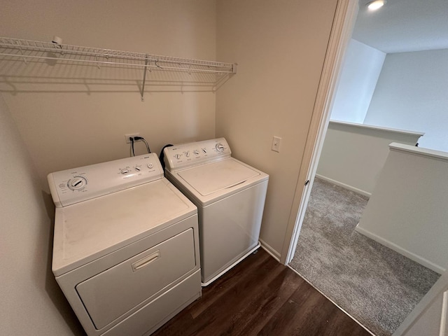 laundry area featuring independent washer and dryer and dark hardwood / wood-style flooring