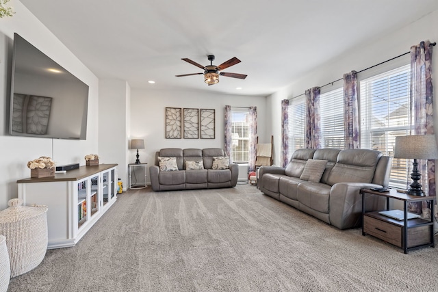 living area featuring a ceiling fan, recessed lighting, and carpet flooring